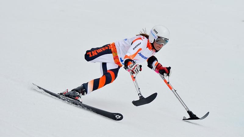 One-legged skier going down the slope.
