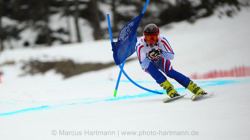 Alexey Bugaev, Russian Federation is so fast his speed moves the gates and takes the gold medal