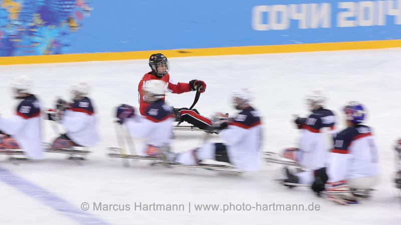 CAN vs USA Players touch gloves after a USA win against Canada 3-0