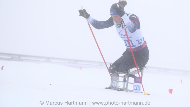 Oksana Masters, USA on the uphill climb in her sitski.