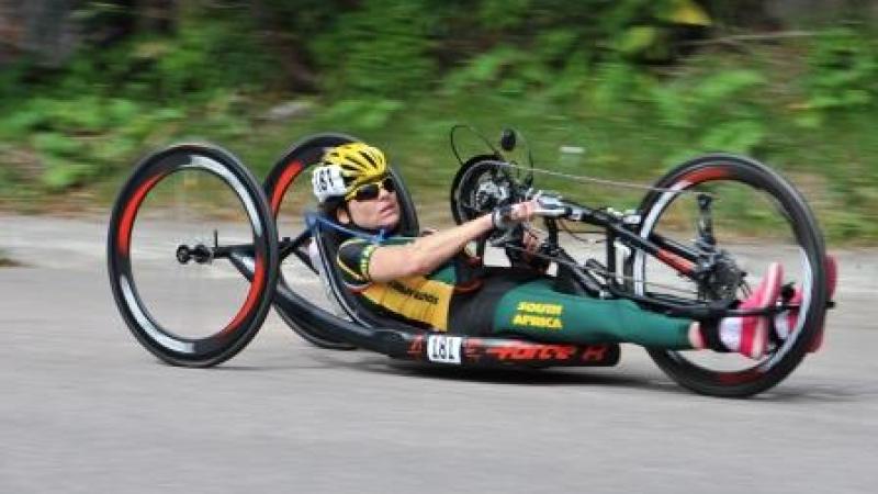 Women in hand-bike racing on a road