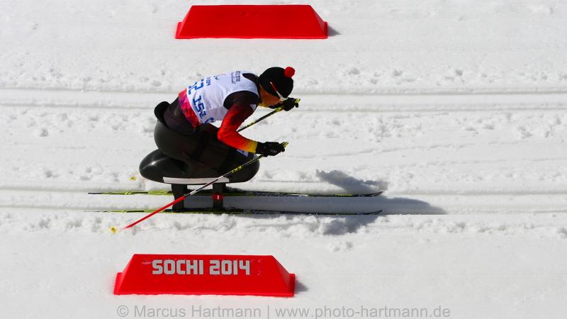 German sit skier Andrea Eskau pushing herself forward.