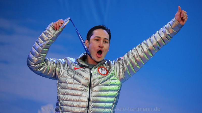 A US para-athlete celebrates winning a medal at the Paralympic Games.