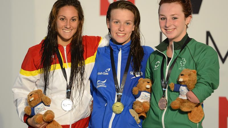 Three female swimmers, Sarai Gascon of Spain, Amy Marren of Great Britain and Ellen Keane of Ireland pose with their 100m butterfly S9 medals at the 2013 IPC Swimming World Championships