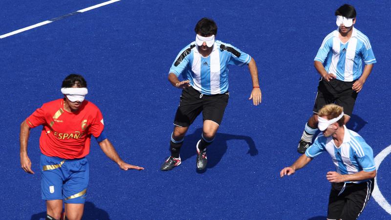 Adolfo Acosta Rodriguez of Spain goes up against three Argentina defenders at the London 2012 Paralympic Games