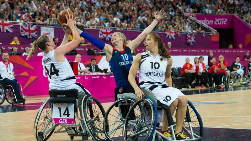 Amy CONROY, Great Britain attempts to snag the ball off Germany's Marina MOHNEN 