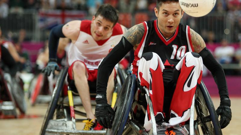 Trevor HIRSCHFIELD, Canada races after the ball in his wheelchair