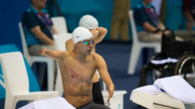 Man with swim cap prepares for the start