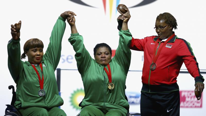 Three heavyweight female powerlifters on the podium at Glasgow 2014.