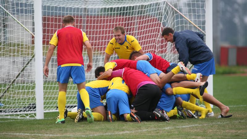 Ukraine celebrate victory at the 2014 CPISRA European Championships in Maia, Portugal.