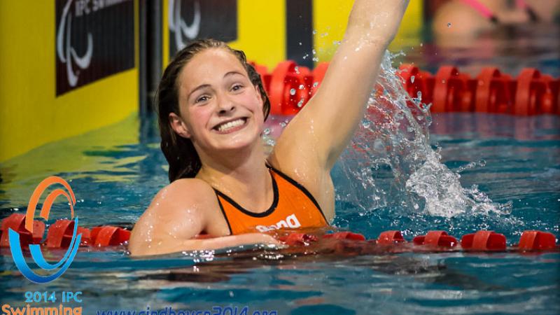 A Dutch swimmers celebrates winning gold at the 2014 IPC Swimming European Championships
