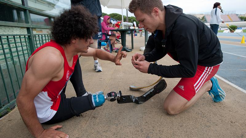 Germany's Rehm shows sportsmanship in fixing Turkey's Baris Telli's prosthetic to allow him to perform better