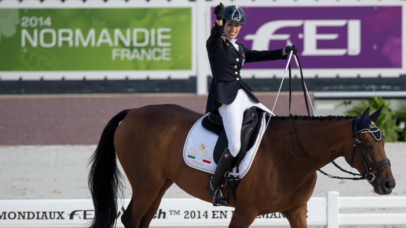 Italian woman celebrates on a horse