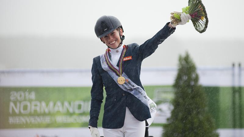 A delighted Rixt van der Horst of Denmark celebrates winning gold at the Alltech FEI World Equestrian Games.
