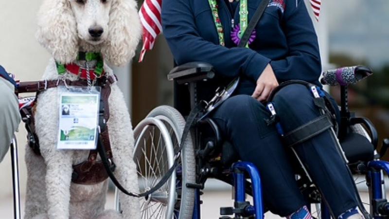 US para-equestrian rider Sydney Collier with service dog Journey.