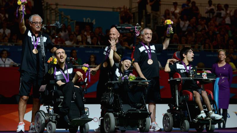 Pieter Cilissen, Kirsten De Laender and Pieter Verlinden of Belgium celebrate winning bronze in the Mixed Pairs Boccia - BC3 at the London 2012 Paralympic Games.
