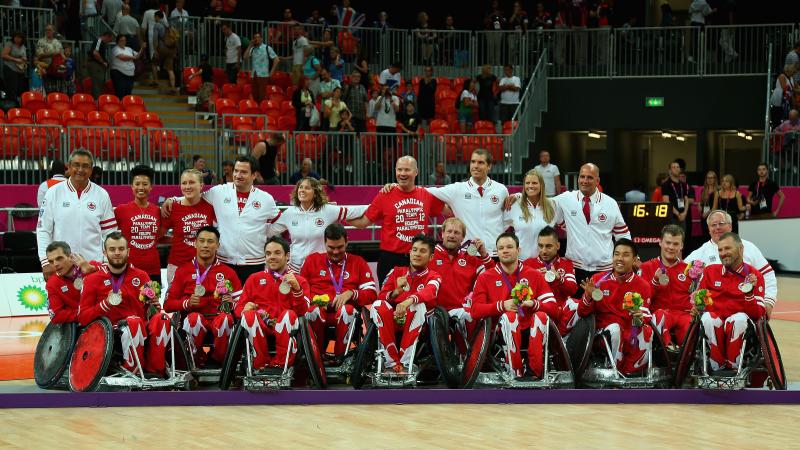 Canadian men celebrating with their medals