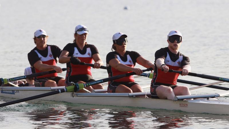 Four rowers in a boat