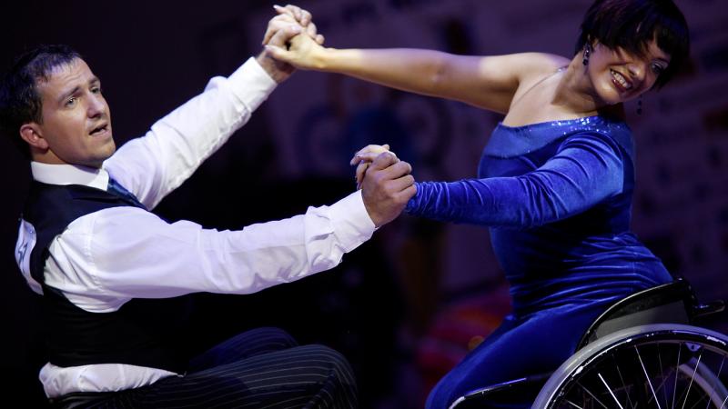 two wheelchair dancers in action