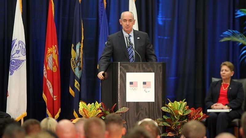 Man on podium doing a speech