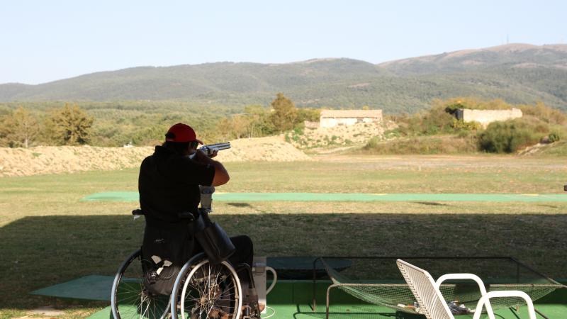 Man in wheelchair targets. Nice landscape in the background