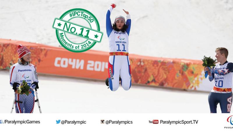 Marie Bochet jumps into the air to celebrate winning Paralympic gold at Sochi 2014.