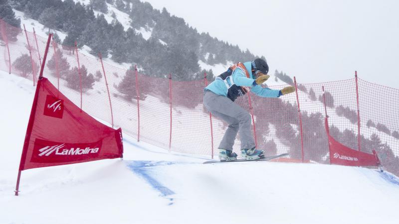 Women on snowboard on the slope