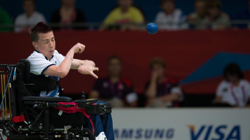 Man in wheelchair throwing a ball