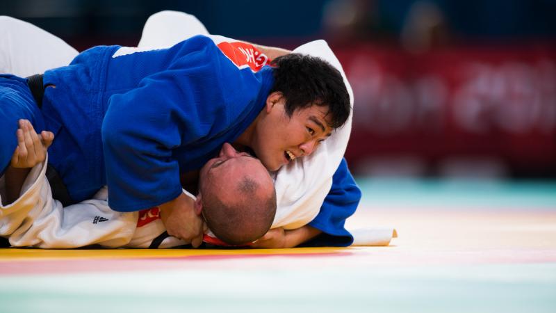 Gwang-Geun Choi of South Korea attacks during the u100kgs quarter-finals at the London 2012 Paralympic Games.