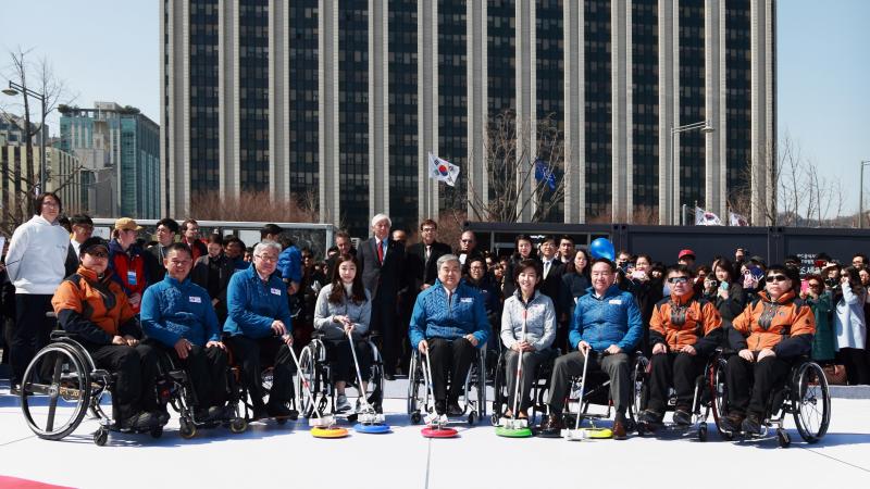 Participants at the first National Paralympic Day in South Korea get ready to try wheelchair curling.