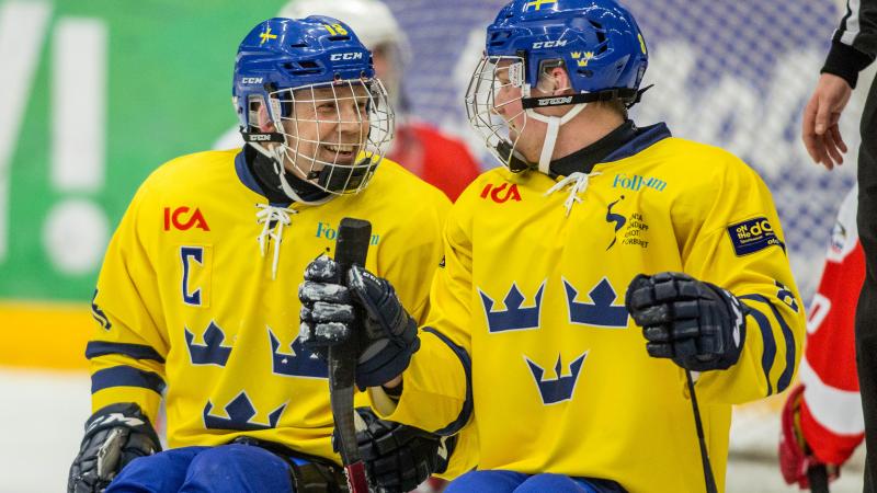 Per Kasperi celebrating with his teammate in the game against Austria at the 2015 IPC Ice Sledge Hockey World Championships B-Pool in Ostersund, Sweden.