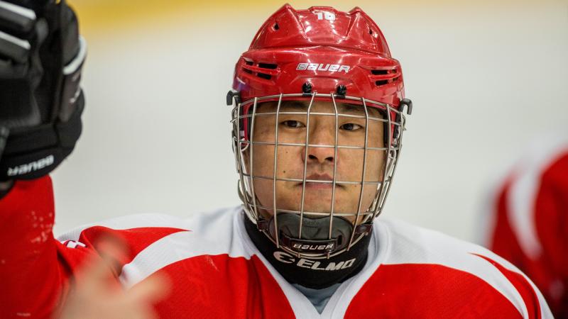 Man with helmet and red jersey