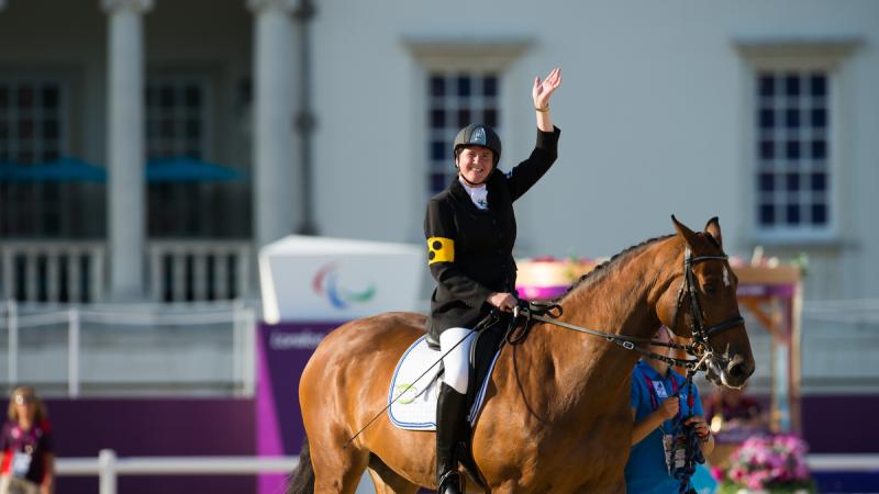 Katja Karjalainen of Finland celebrating her silver medal in the Mixed Dressage - Freestyle grade Ib at the London 2012 Paralympic Games.