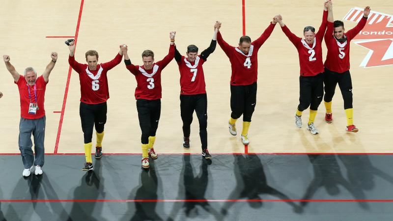 The Belgium team celebrate after their victory during the Men's Group B Goalball match between Belgium and Canada at the London 2012 Paralympic Games