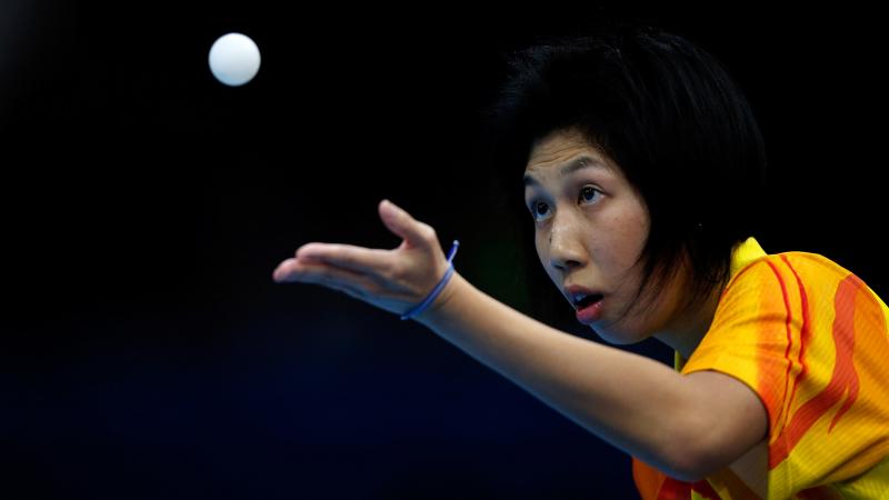 Ka Man Wong of Hong Kong serves during her Women's singles Gold medal match against Chi Ka Yeung of Hong Kong at the London 2012 Paralympic Games.