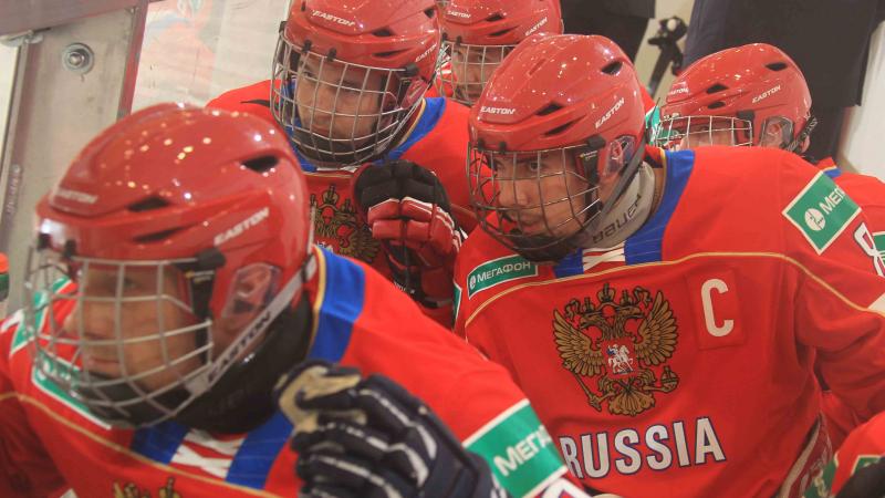 Group of ice sledge hockey players