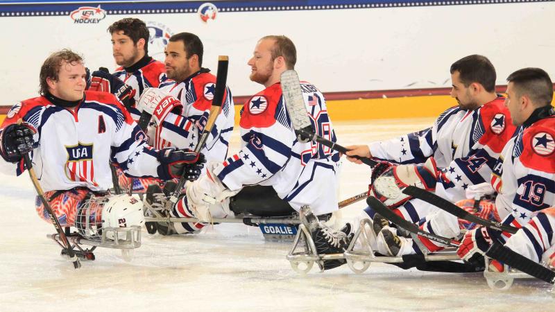 Group of ice sledge hockey players on the ice