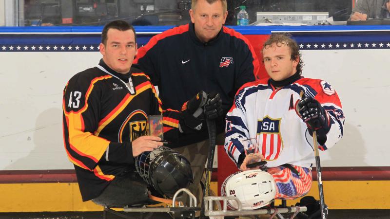 Best players of the preliminary game, Joshua Pauls, USA, and Bernhard Hering, Germany, at the 2015 IPC Ice Sledge Hockey World Championships A-Pool Buffalo.