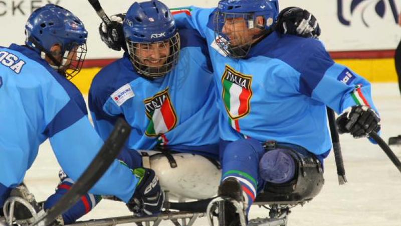 Italy's players celebrate after winning their playoff game at Buffalo 2015.