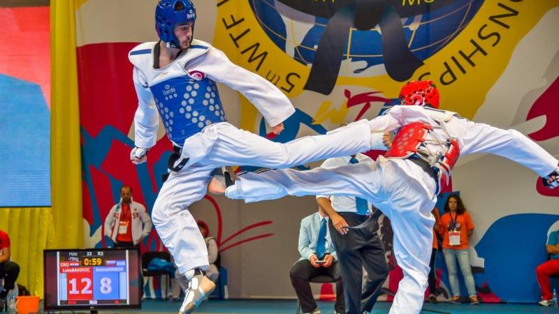 Two athletes doing taekwondo