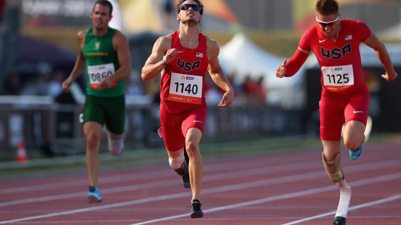 US sprinter Jarryd Wallace wins the men's 200m T44 World Championships race.