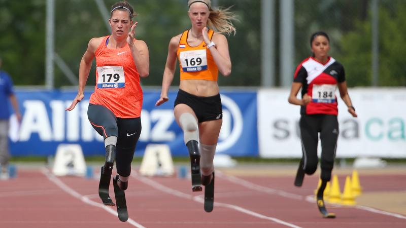 A sprinter overtakes another runner on the 100m straight.