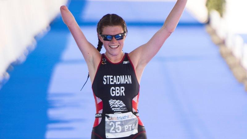 Woman crossing a finish line, celebrating