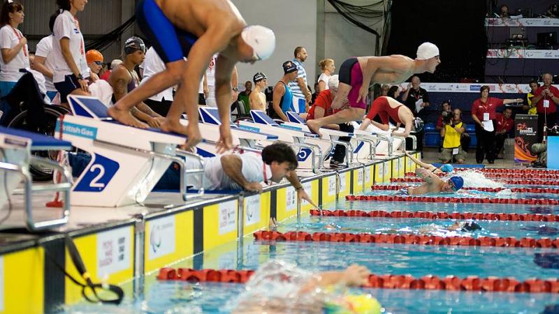 Swimmers begin their race