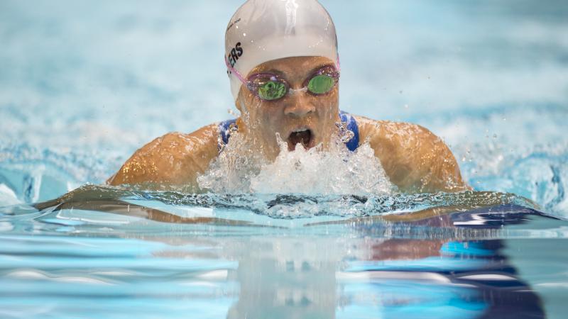 A visually impaired athlete swims