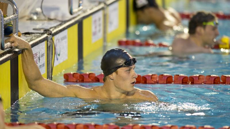 A intellectually impaired swimmer finishes a race