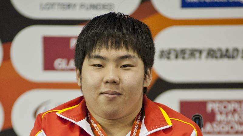 Man in wheelchair on the podium