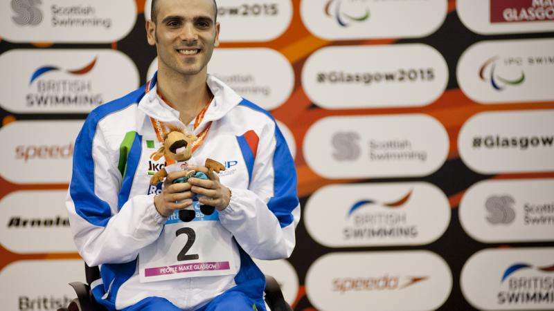 Vincenzo Boni of Italy on the podium after the Men's 50m Backstroke S3 at the 2015 IPC Swimming World Championships in Glasgow.