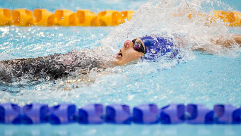 Swimmer doing backstroke in the water