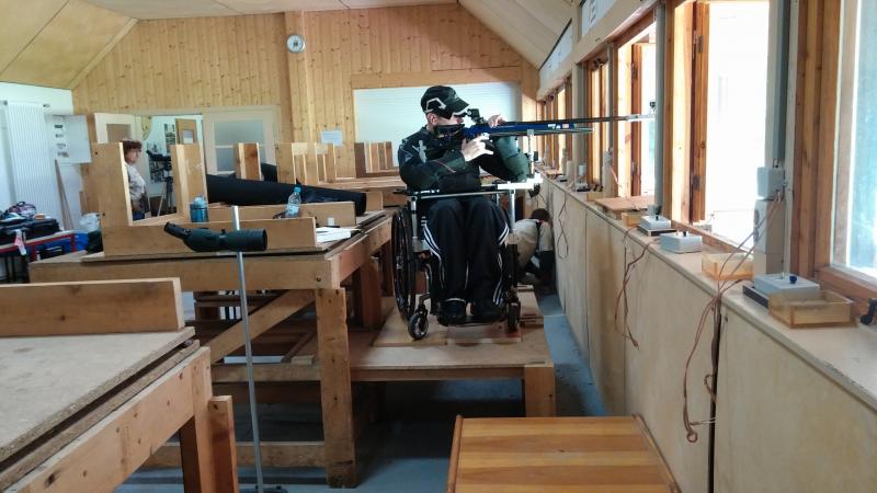 Man in wheelchair in a shooting range